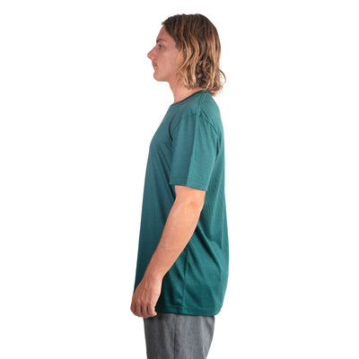 Side shot of Ottie Merino men's Otway Fern short sleeve merino wool t-shirt on 173cm model who is wearing a size medium