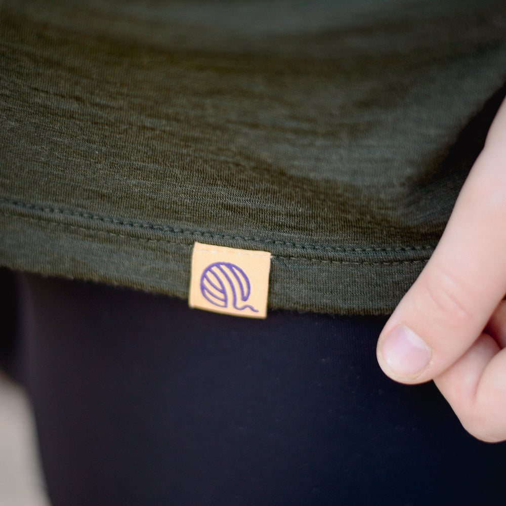 Ottie wool-ball label on the hem